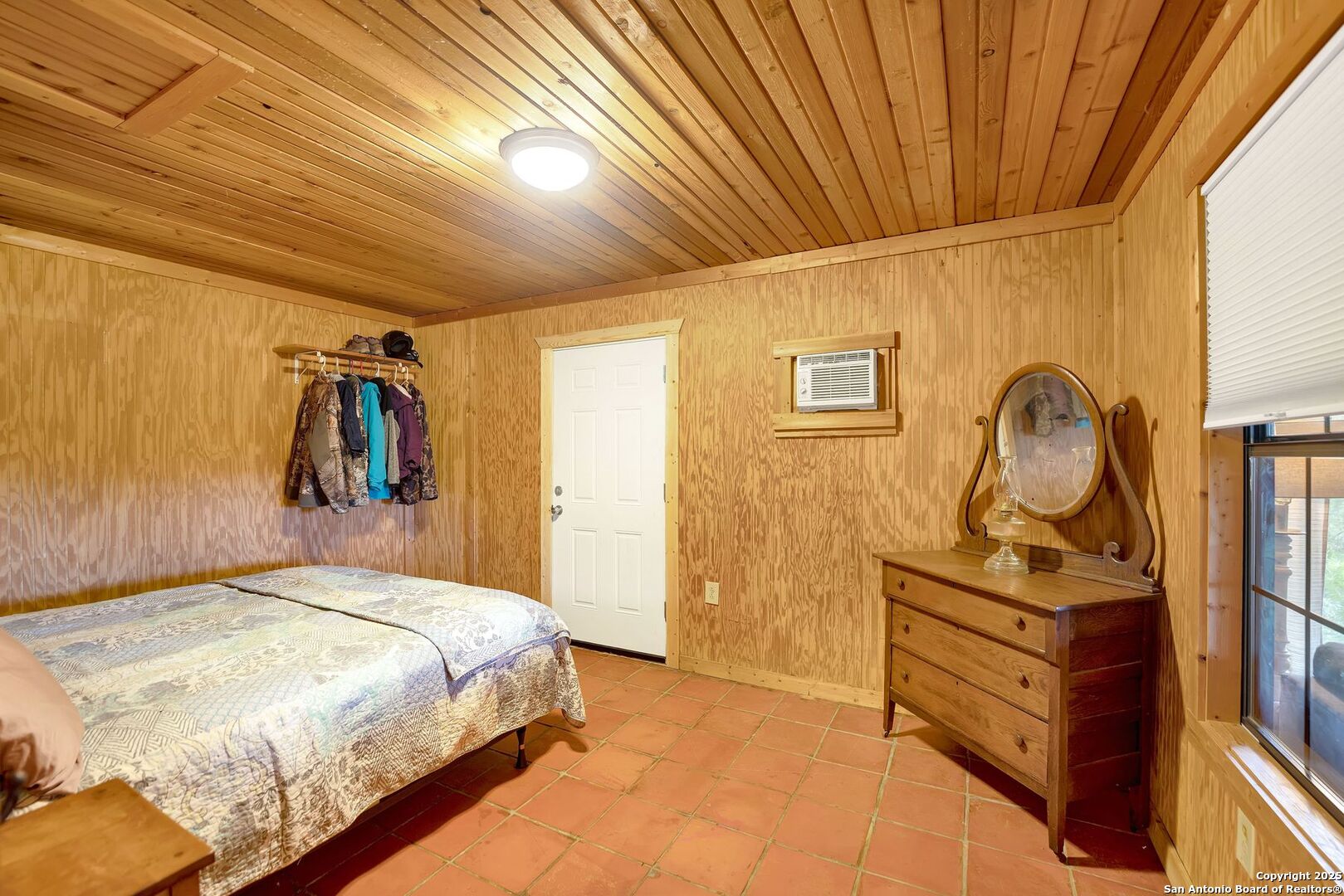 3695 Rio Hondo Road Tarpley, TX 78883 - Photo 34 of 47 a bedroom with a bed and a dresser