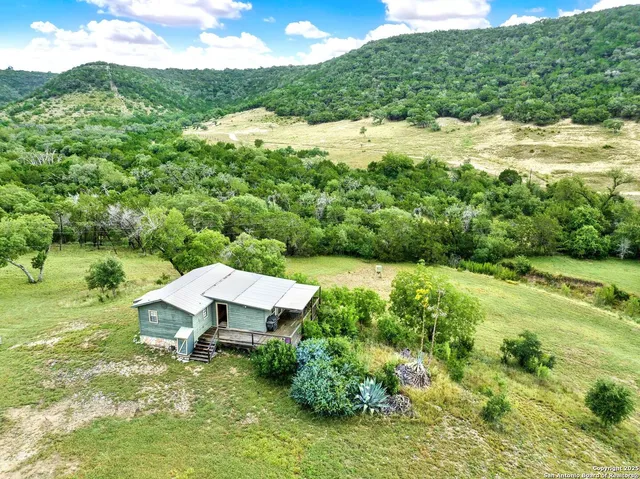 a view of a lake with a house in the background