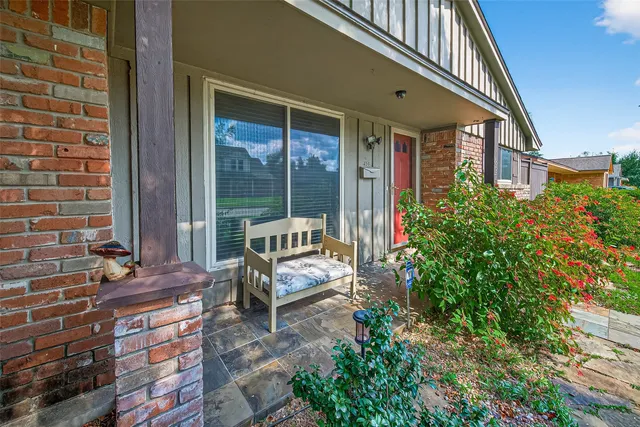 a kitchen with stainless steel appliances granite countertop a sink and a refrigerator