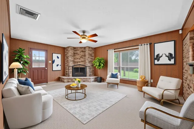 a bedroom with a bed couch and a window