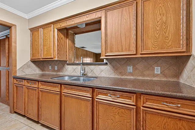 a bathroom with a granite countertop toilet sink shower and mirror