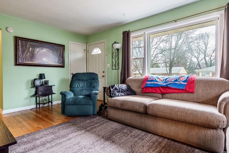 3715 Rural Street Rockford, IL 61107 - Photo 13 of 35 a living room with furniture and a large window