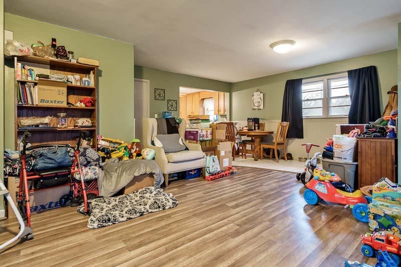3715 Rural Street Rockford, IL 61107 - Photo 20 of 35 a living room with lots of furniture and a wooden floor
