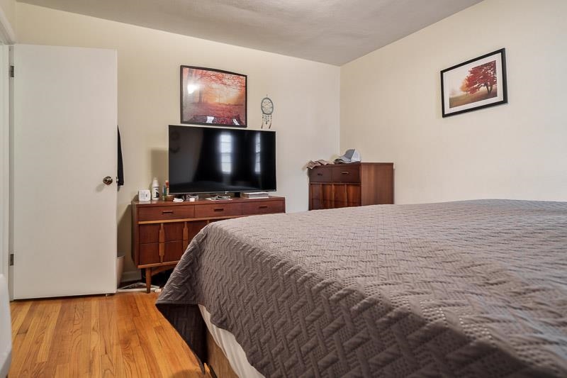 3715 Rural Street Rockford, IL 61107 - Photo 22 of 35 a bedroom with a bed and a flat screen tv