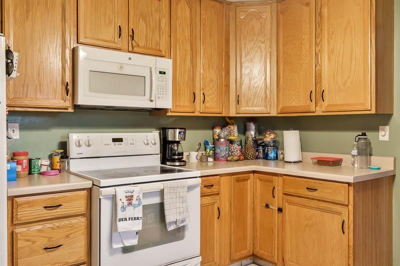 3715 Rural Street Rockford, IL 61107 - Photo 27 of 35 a kitchen with stainless steel appliances granite countertop a sink dishwasher and cabinets with wooden floor