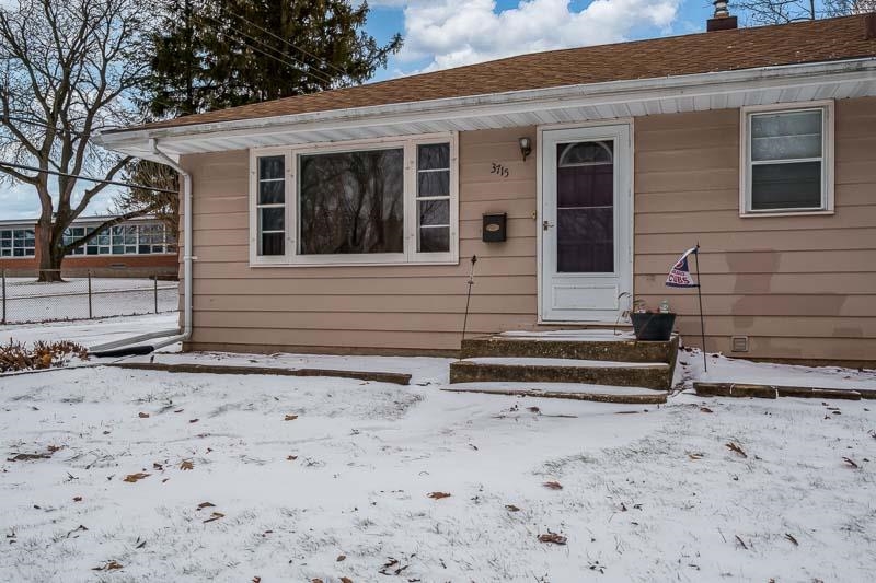 3715 Rural Street Rockford, IL 61107 - Photo 3 of 35 a view of a house with a wooden fence