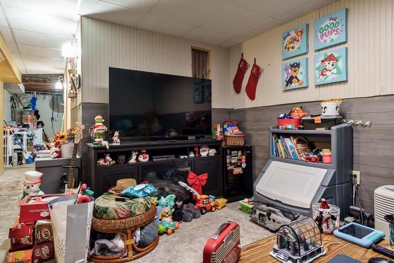 3715 Rural Street Rockford, IL 61107 - Photo 31 of 35 a room with furniture and a flat screen tv