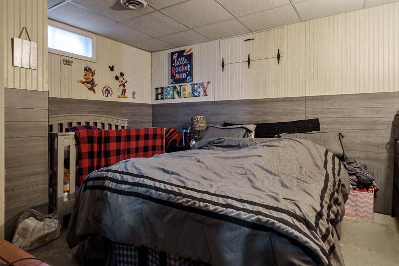 3715 Rural Street Rockford, IL 61107 - Photo 32 of 35 a bed sitting in a bedroom next to a window