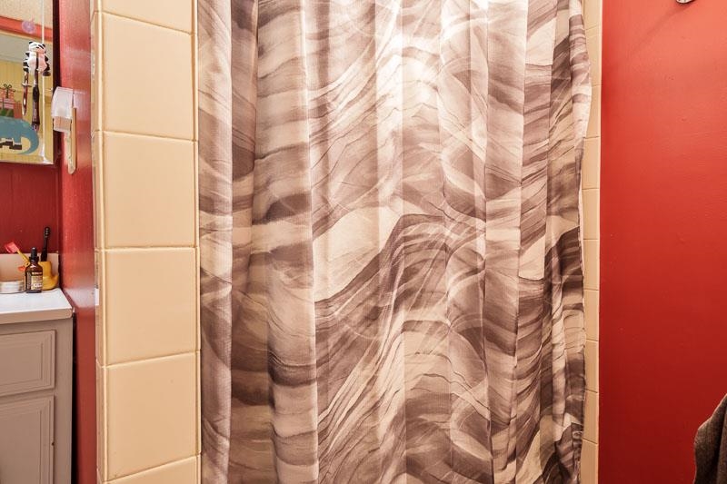 3715 Rural Street Rockford, IL 61107 - Photo 34 of 35 a bathroom with a shower curtain