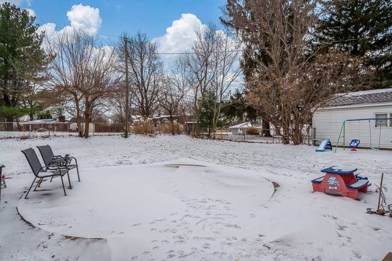 3715 Rural Street Rockford, IL 61107 - Photo 6 of 35 a view of a backyard with a snow