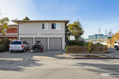a view of a cars parked in front of a house