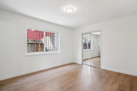 a view of livingroom with hardwood floor and hallway