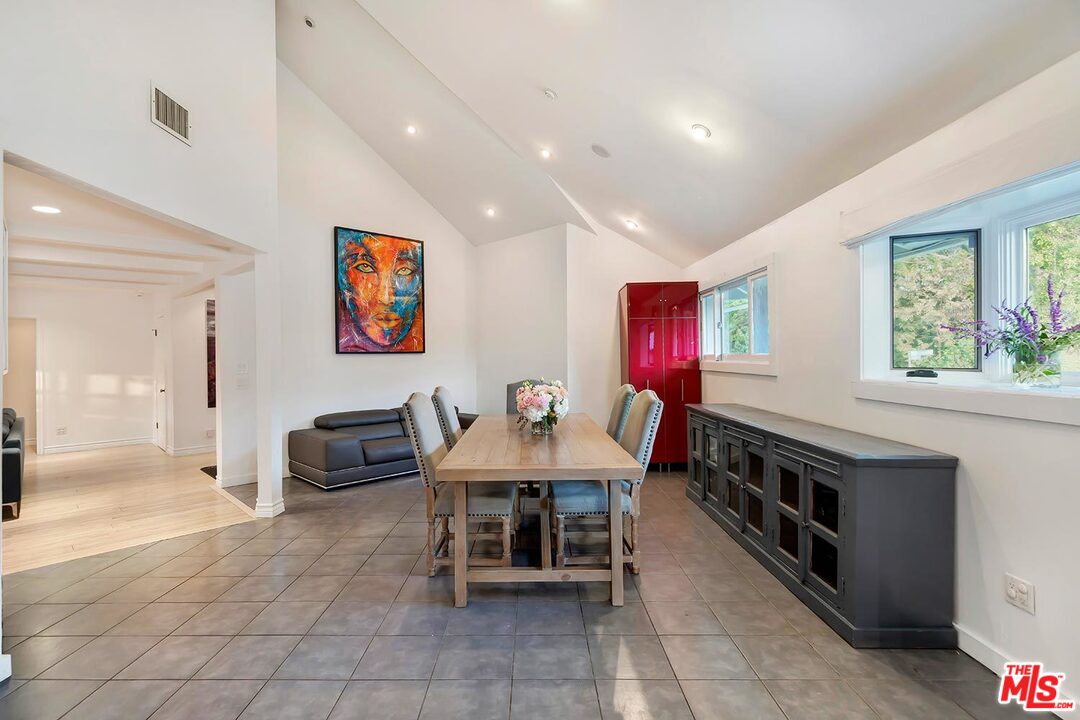 3389 Wrightview Place Studio City, CA 91604 - Photo 12 of 20 a living room with furniture a window and a flat screen tv