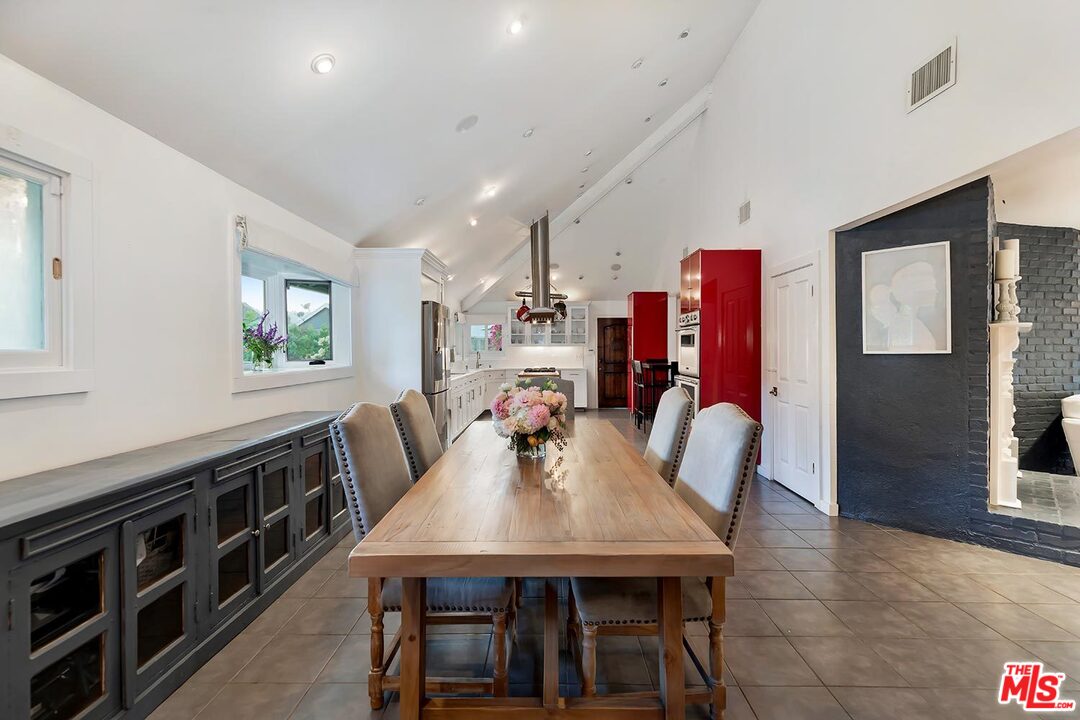 3389 Wrightview Place Studio City, CA 91604 - Photo 13 of 20 a view of a dining room with furniture window and wooden floor