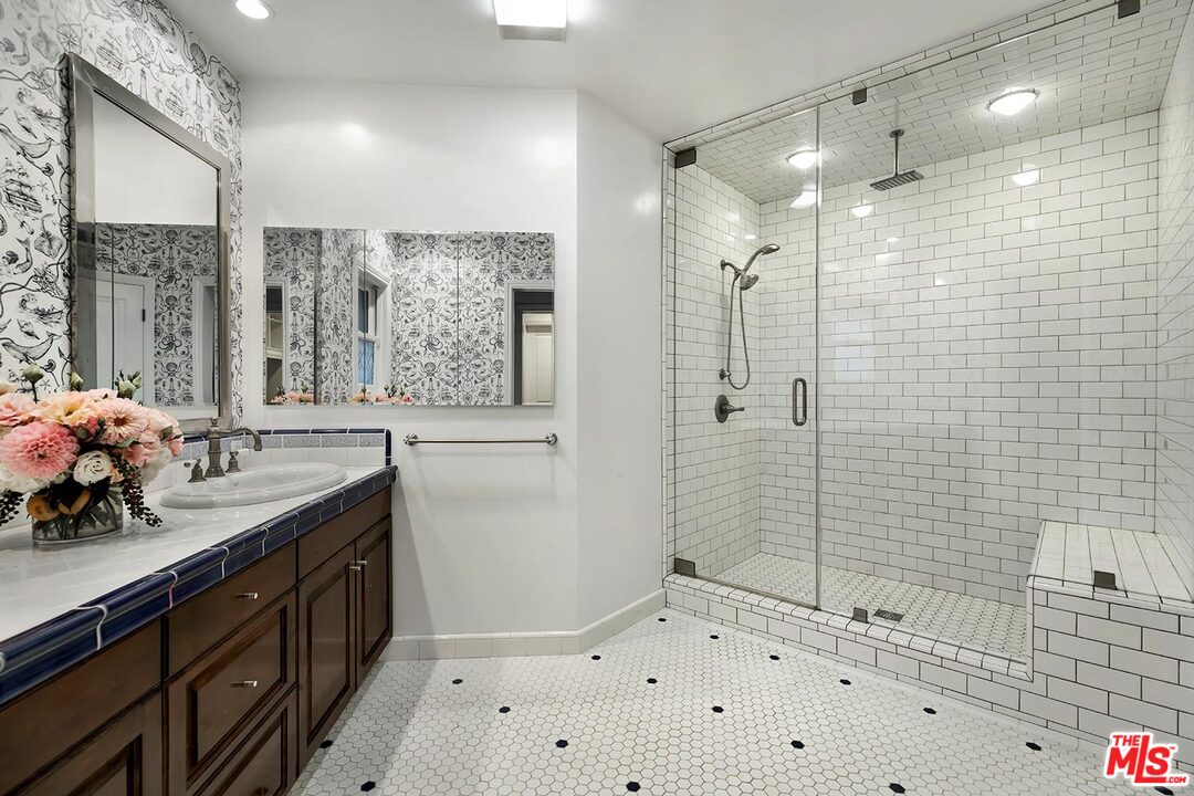 3389 Wrightview Place Studio City, CA 91604 - Photo 15 of 20 a bathroom with a shower sink and mirror