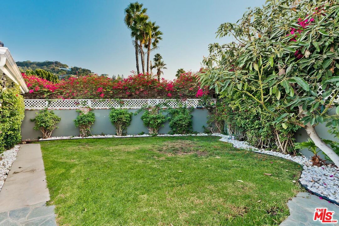 3389 Wrightview Place Studio City, CA 91604 - Photo 19 of 20 a view of a garden with a lake