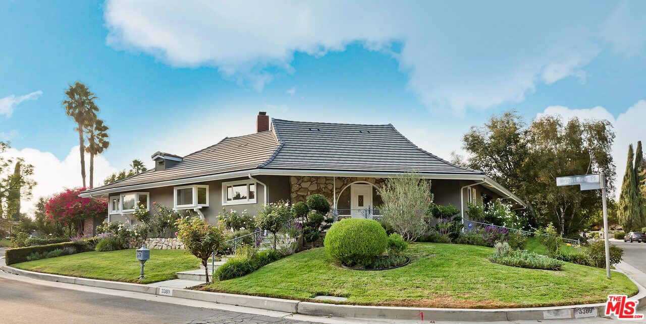 3389 Wrightview Place Studio City, CA 91604 - Photo 2 of 20 a front view of a house with garden