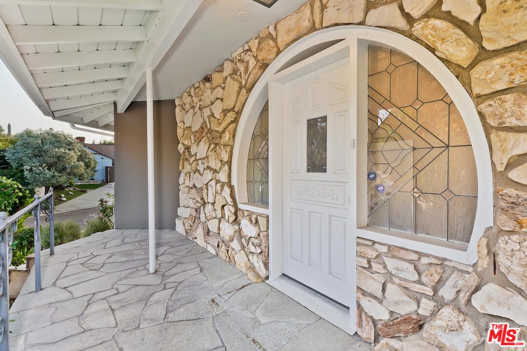 3389 Wrightview Place Studio City, CA 91604 - Photo 3 of 20 a view of a wooden door with a outdoor space