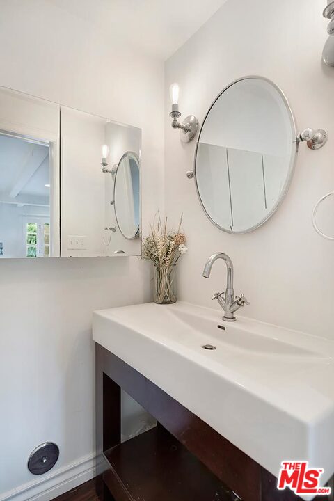 3389 Wrightview Place Studio City, CA 91604 - Photo 6 of 20 a bathroom with a sink and a mirror