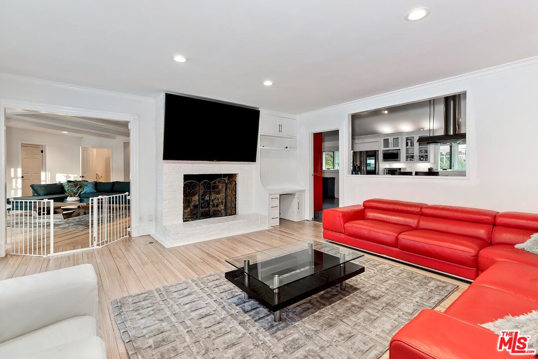 3389 Wrightview Place Studio City, CA 91604 - Photo 8 of 20 a living room with furniture and a flat screen tv