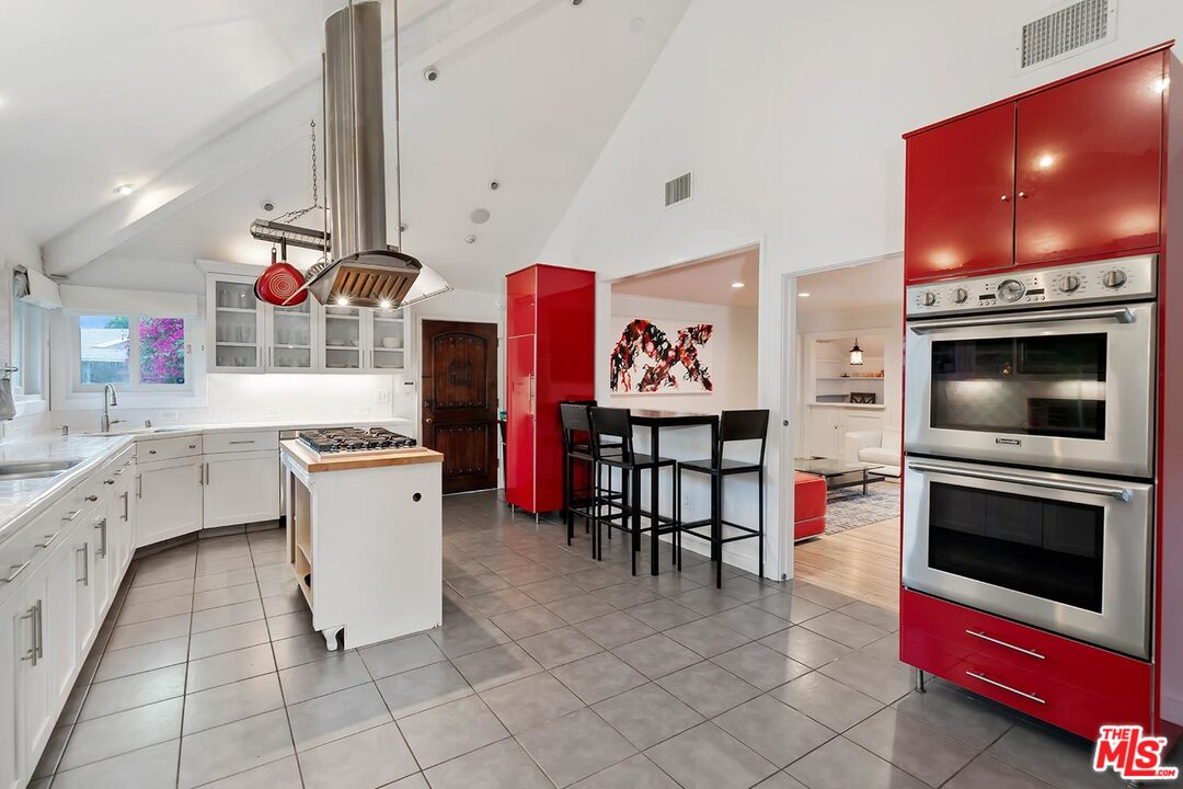 3389 Wrightview Place Studio City, CA 91604 - Photo 10 of 20 a kitchen with stainless steel appliances a stove a sink and a microwave