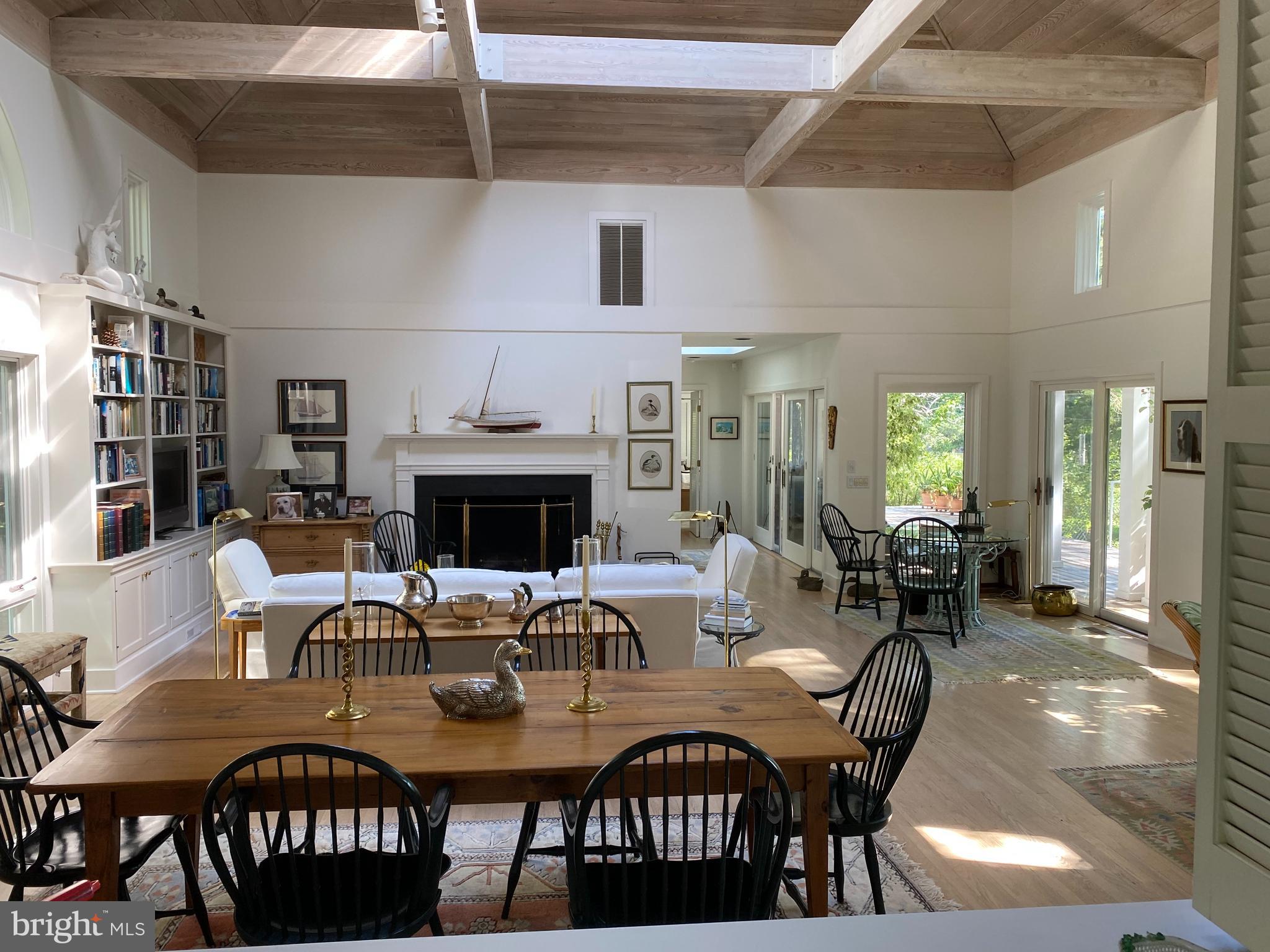 23452 Pine Point Road, Unit 23452 Bozman, MD 21612 - Photo 17 of 30 great room with two-story ceiling and fireplace