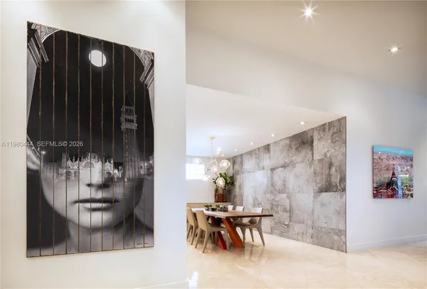 a kitchen with a table and chairs in it