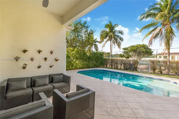 a living room with furniture and a rug