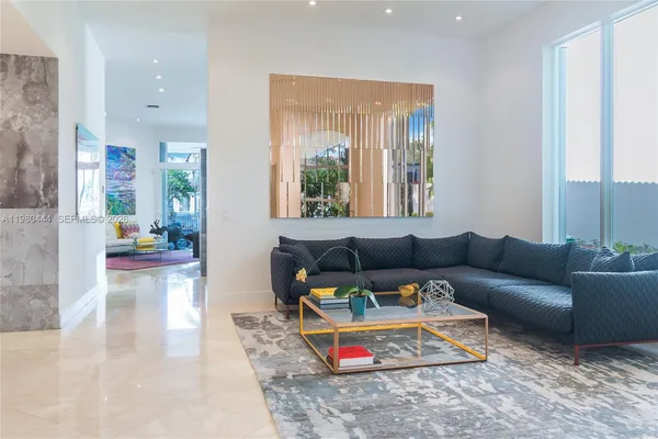 a living room with furniture and a rug