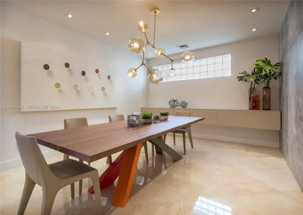 a kitchen with stainless steel appliances a stove a refrigerator and a sink