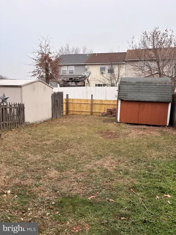 a kitchen with a sink stove and mirror