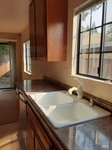 a stove top oven sitting inside of a kitchen