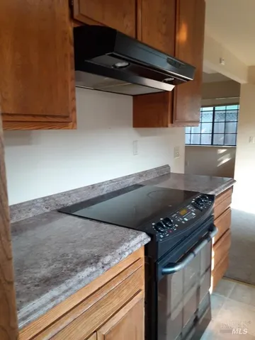 a backyard of a house with wooden fence