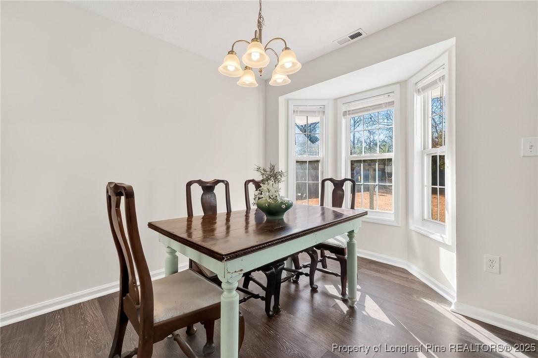 240 Rock Harbor Lane Spring Lake, NC 28390 - Photo 11 of 35 a dining room with furniture and window
