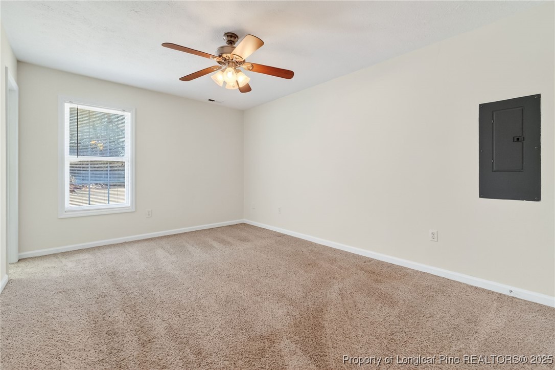 240 Rock Harbor Lane Spring Lake, NC 28390 - Photo 21 of 35 an empty room with windows and fan