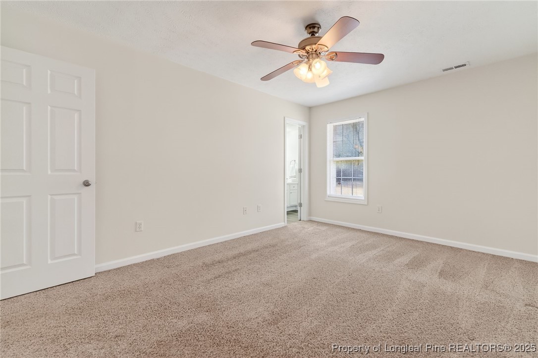 240 Rock Harbor Lane Spring Lake, NC 28390 - Photo 22 of 35 an empty room with a window and a ceiling fan