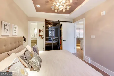 a bedroom with a large bed and a couch