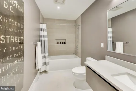 a bathroom with a sink a toilet and a bathtub