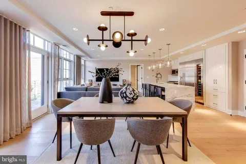 a view of a dining room with furniture and window