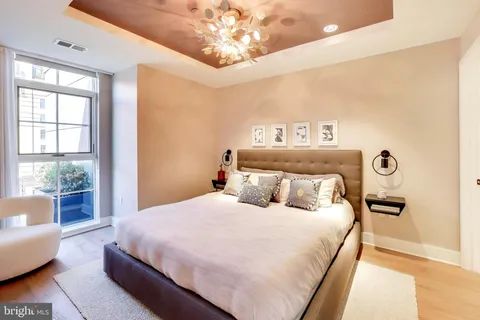 a bedroom with a large bed and a couch