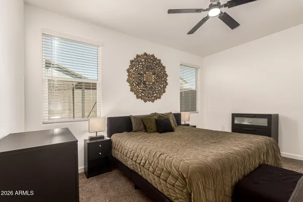 a bedroom with a large bed and a window