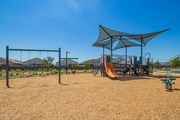 a view of a grassy field with an trees