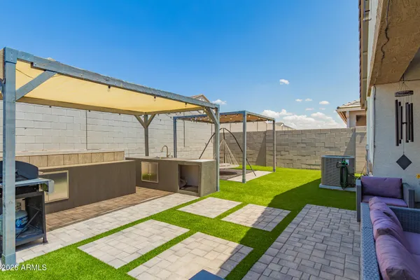 a view of yard with patio