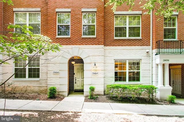 a front view of a house having yard