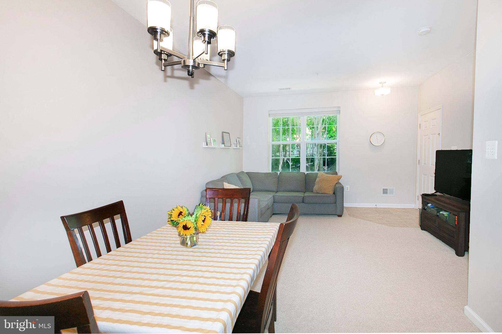 12426 Liberty Bridge Road Fairfax, VA 22033 - Photo 11 of 28 a bedroom with a bed furniture and a window