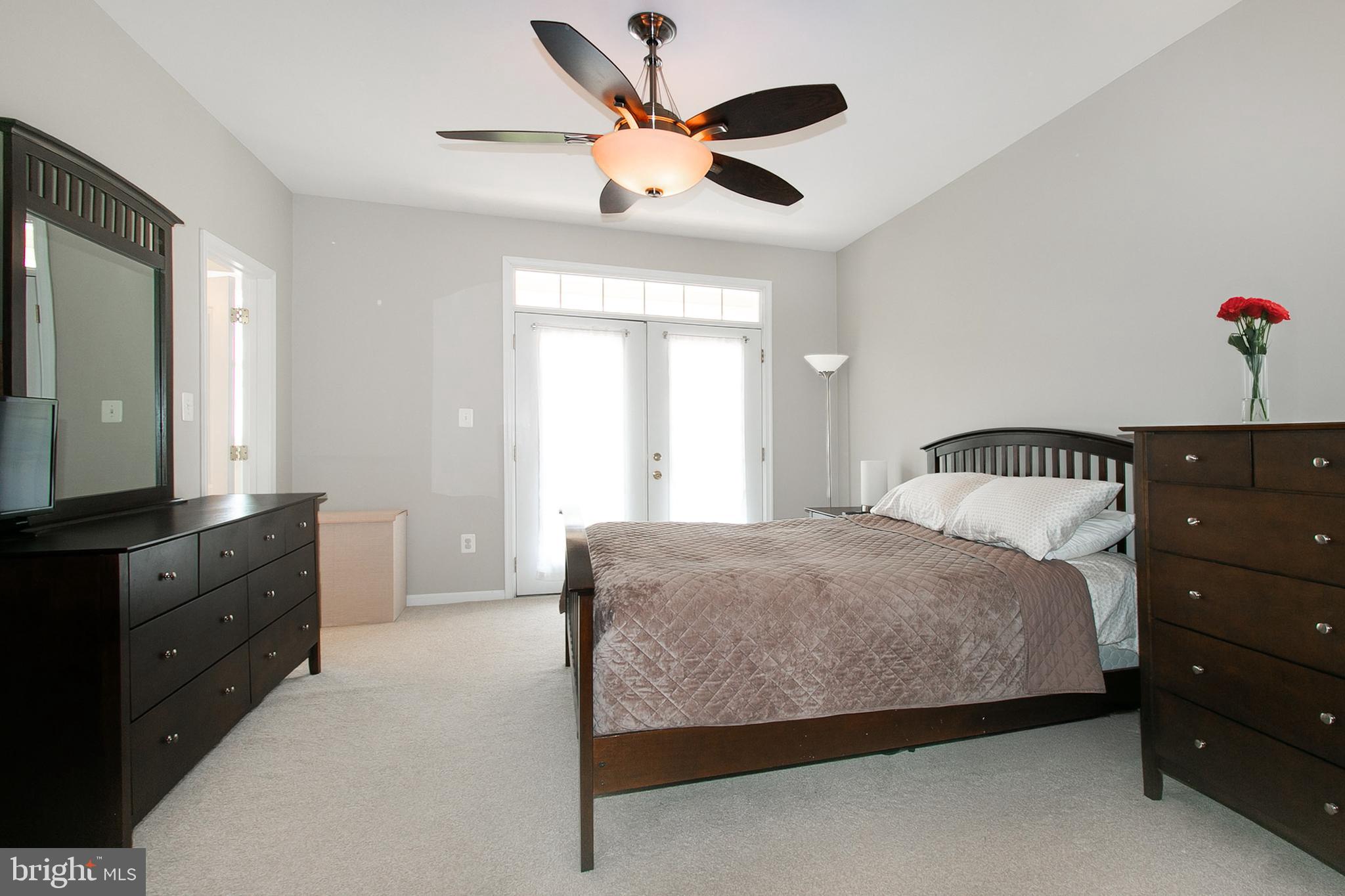 12426 Liberty Bridge Road Fairfax, VA 22033 - Photo 15 of 28 a bedroom with a bed and window
