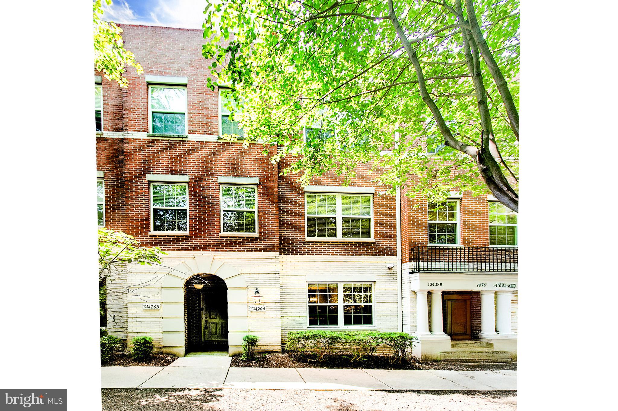 12426 Liberty Bridge Road Fairfax, VA 22033 - Photo 2 of 28 a front view of a house with a yard
