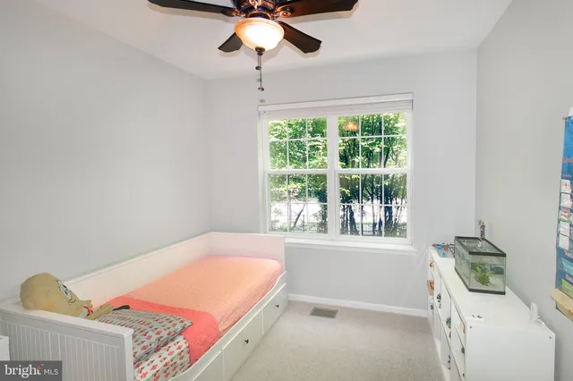 a room with a bed and a window