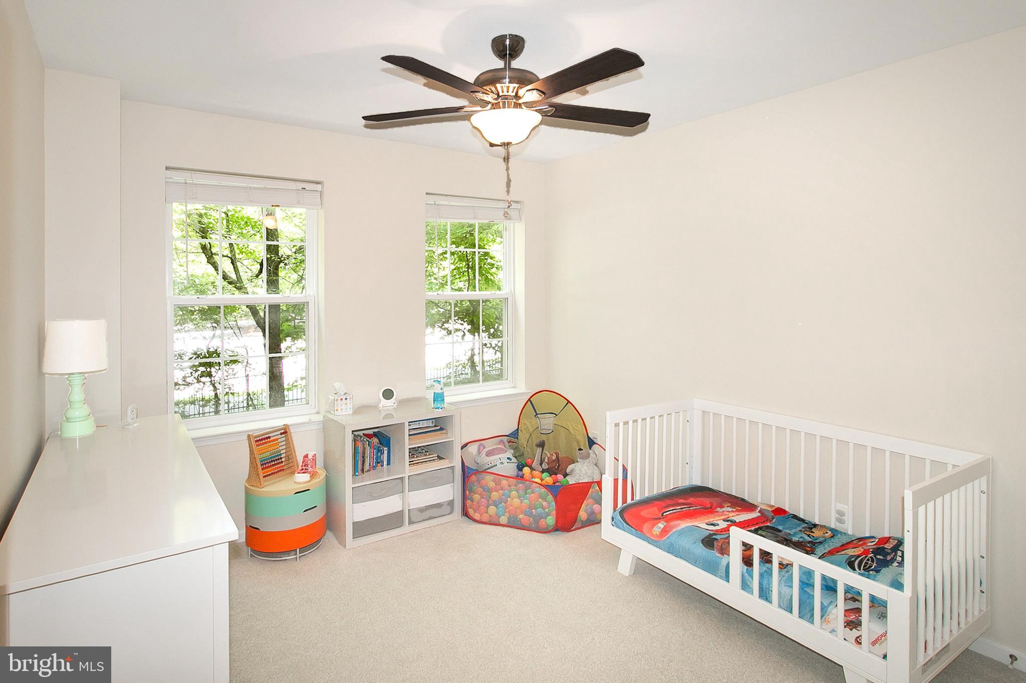 12426 Liberty Bridge Road Fairfax, VA 22033 - Photo 23 of 28 a bedroom with furniture and a chandelier