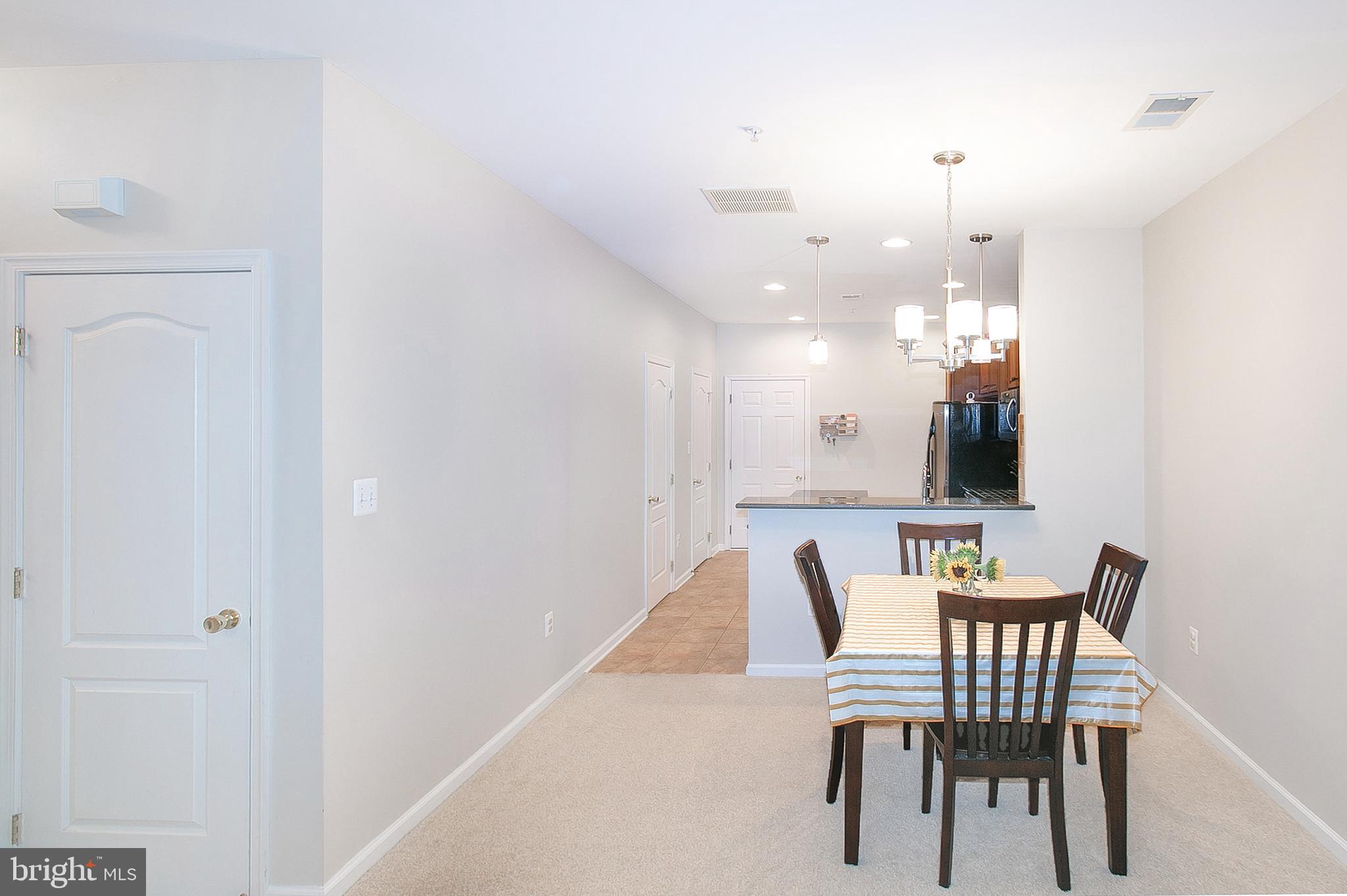 12426 Liberty Bridge Road Fairfax, VA 22033 - Photo 6 of 28 a view of a dining room with furniture